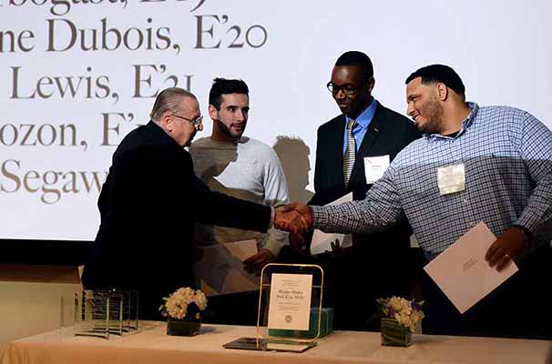 Alumni giving students a scholarship
