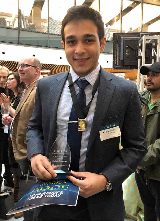 students hold award in front of research poster at RISE competition