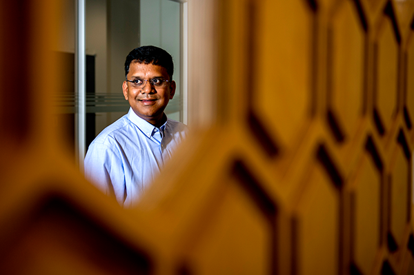 auroop ganguly looking off to the left