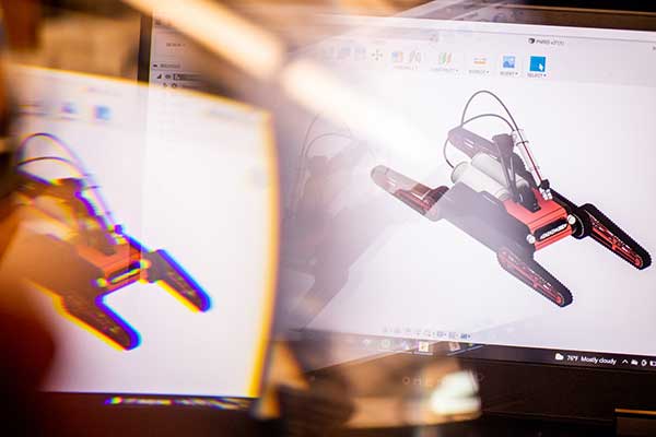 reflection of a robot on computer screen